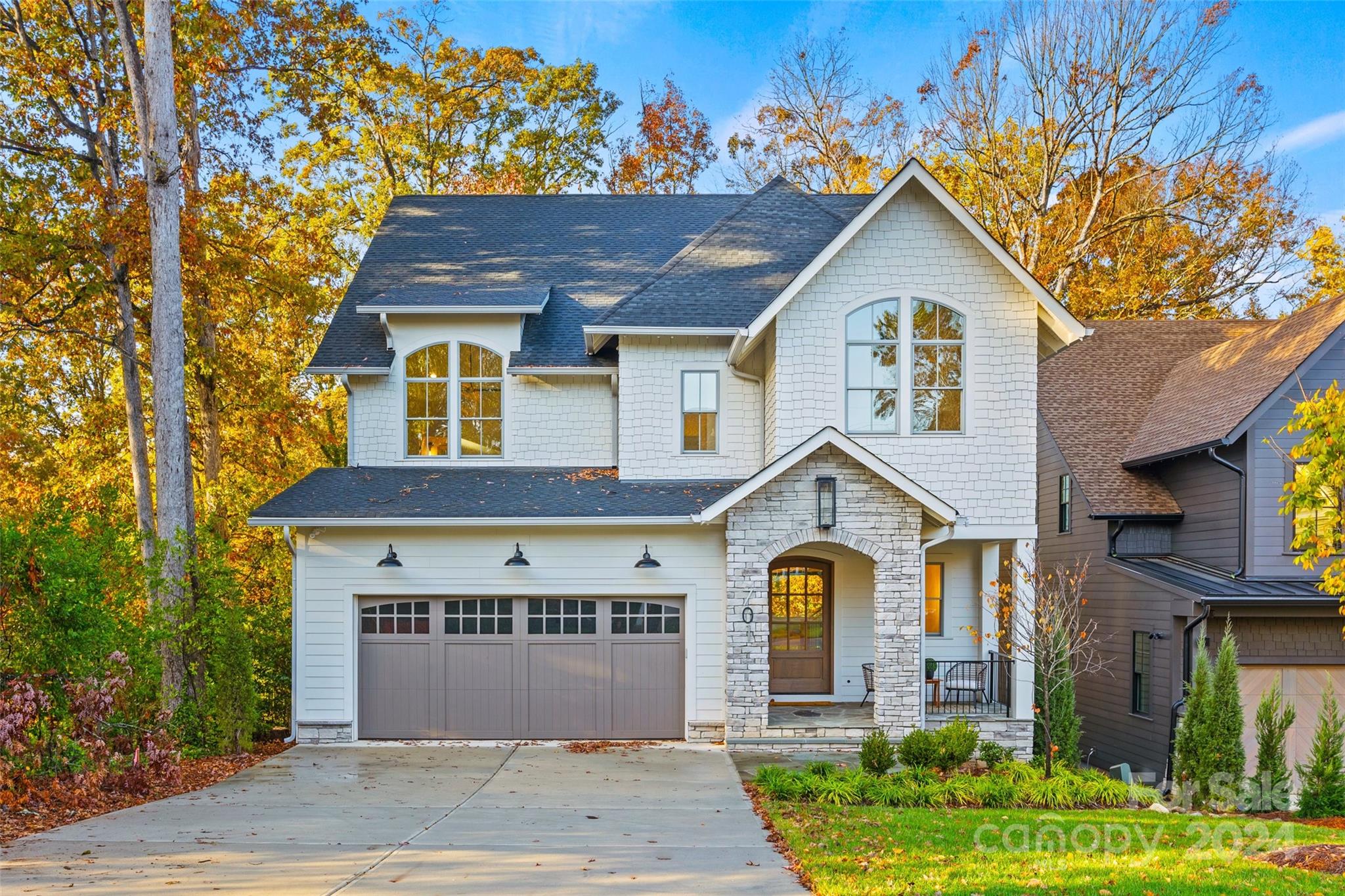 a front view of a house with garden