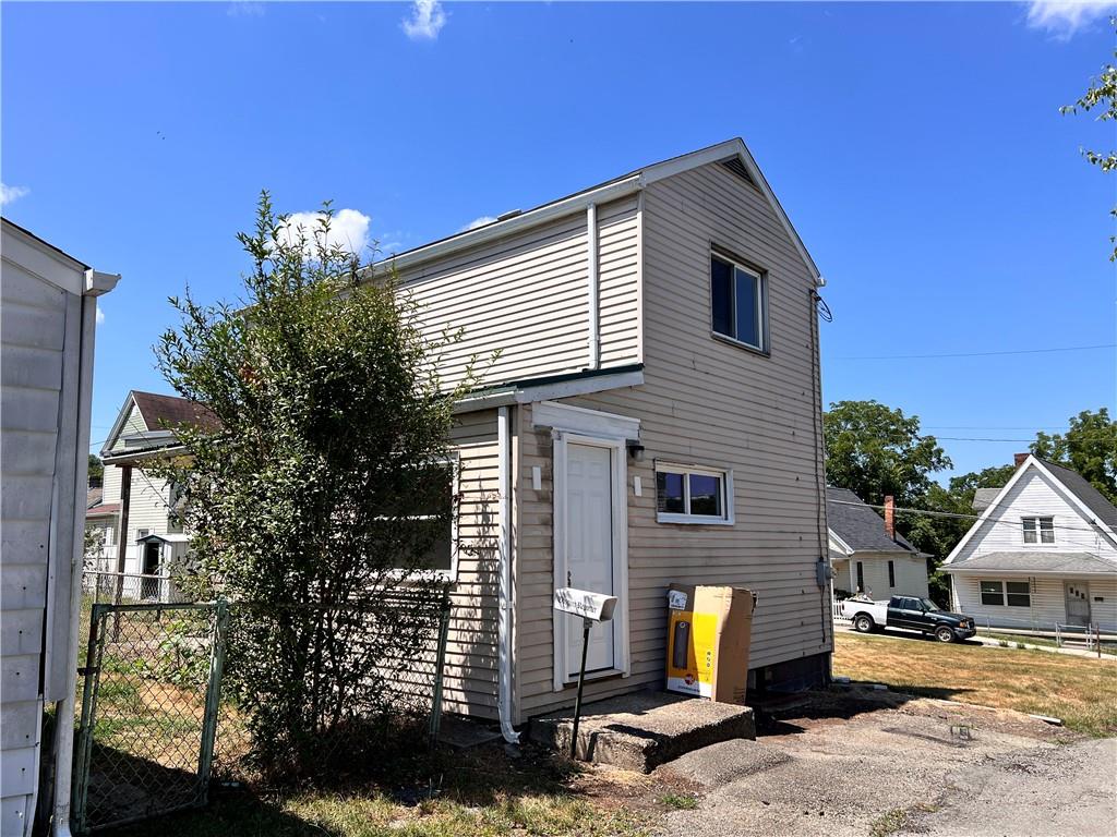 a front view of a house with yard