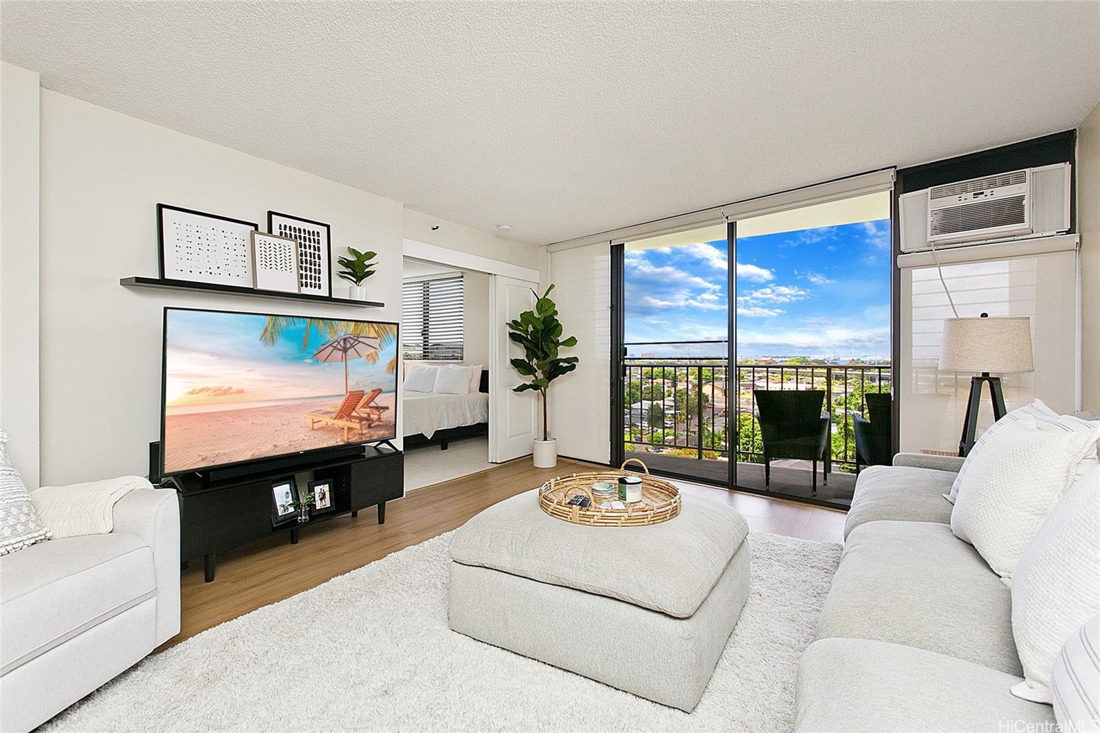 a living room with furniture and a flat screen tv