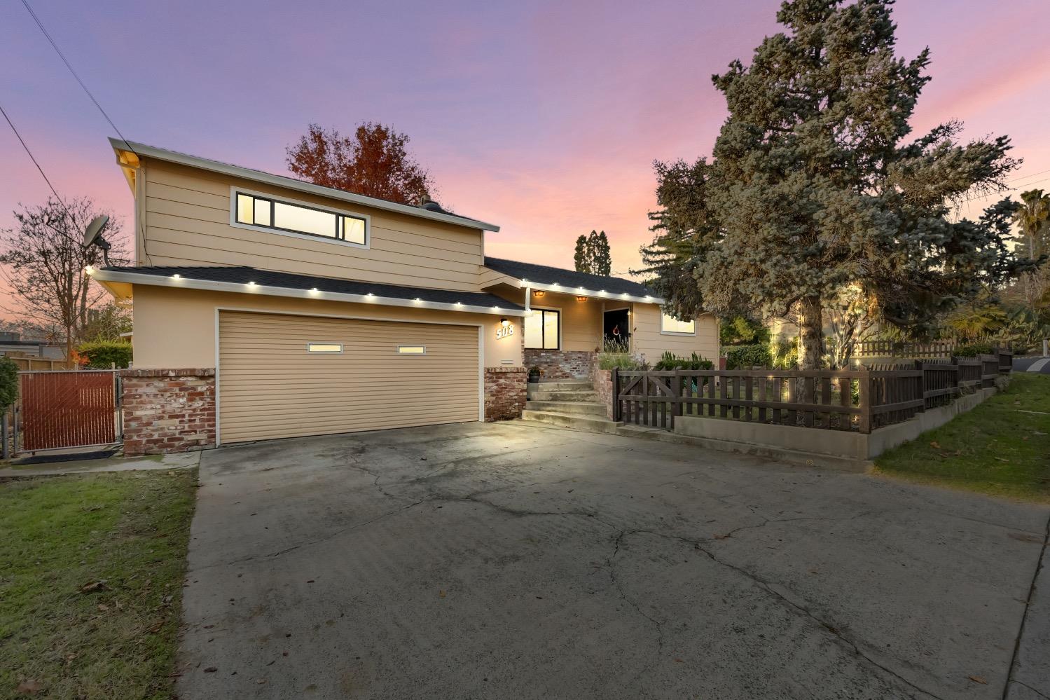 a view of a house with a outdoor space and backyard