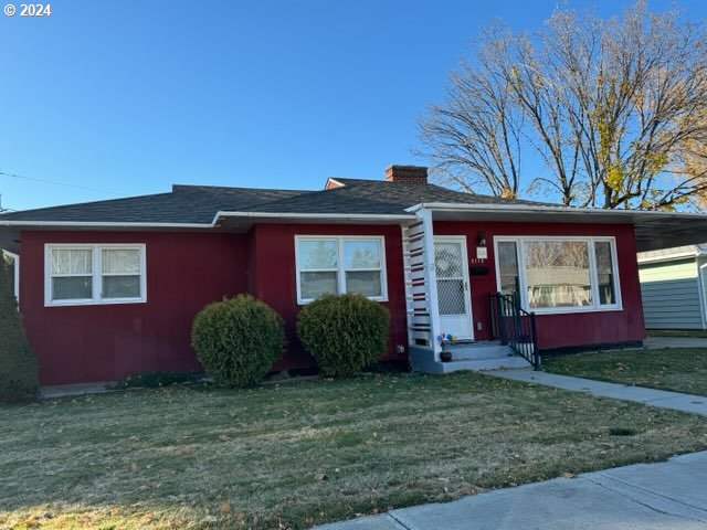 front view of a house with a yard