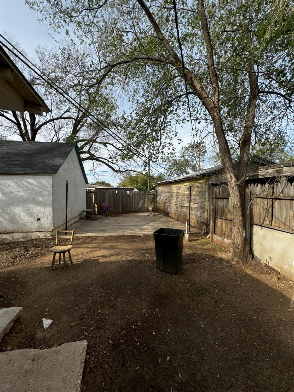 a view of backyard with swimming pool