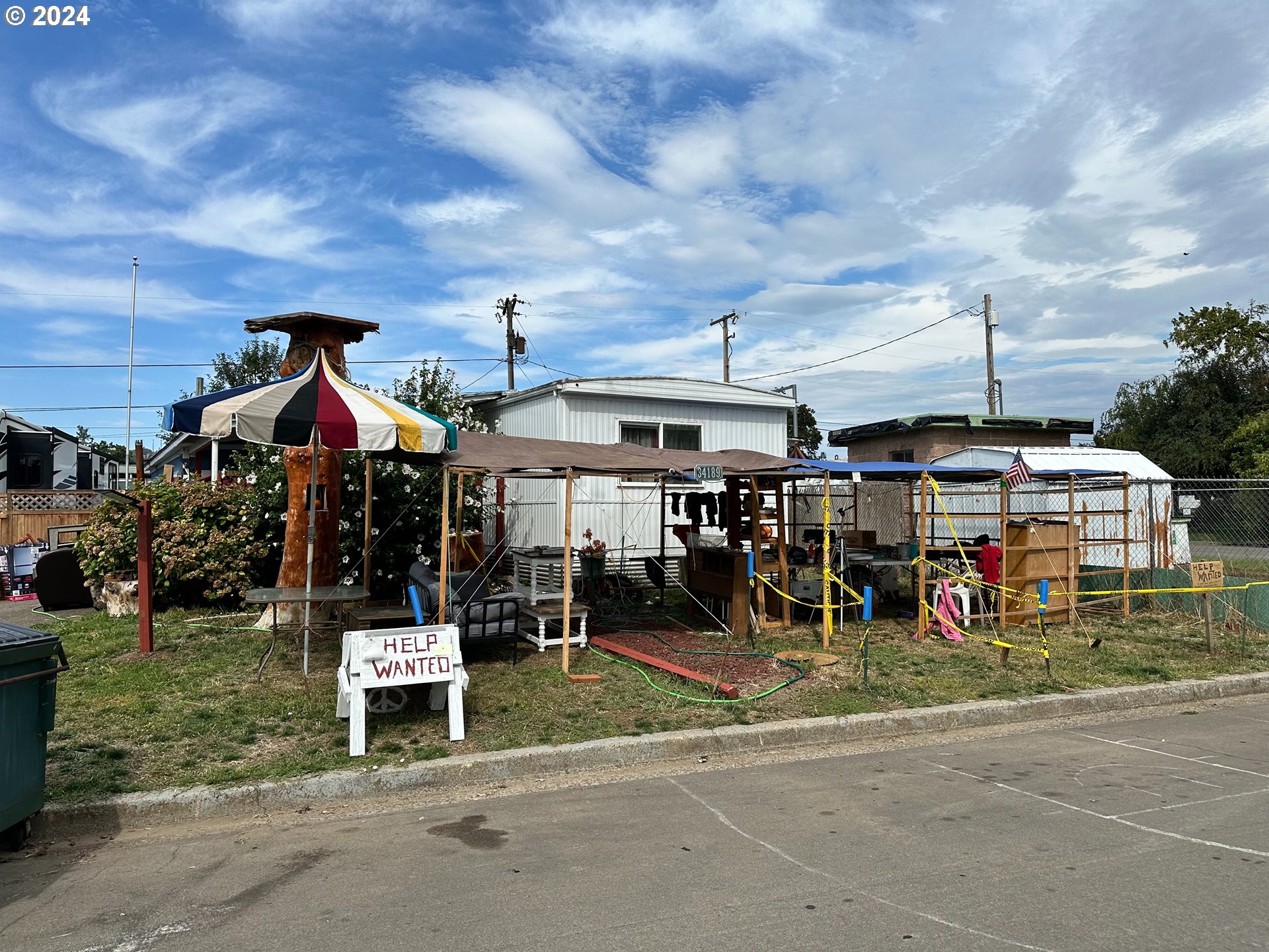 a group of people sitting outside of a house