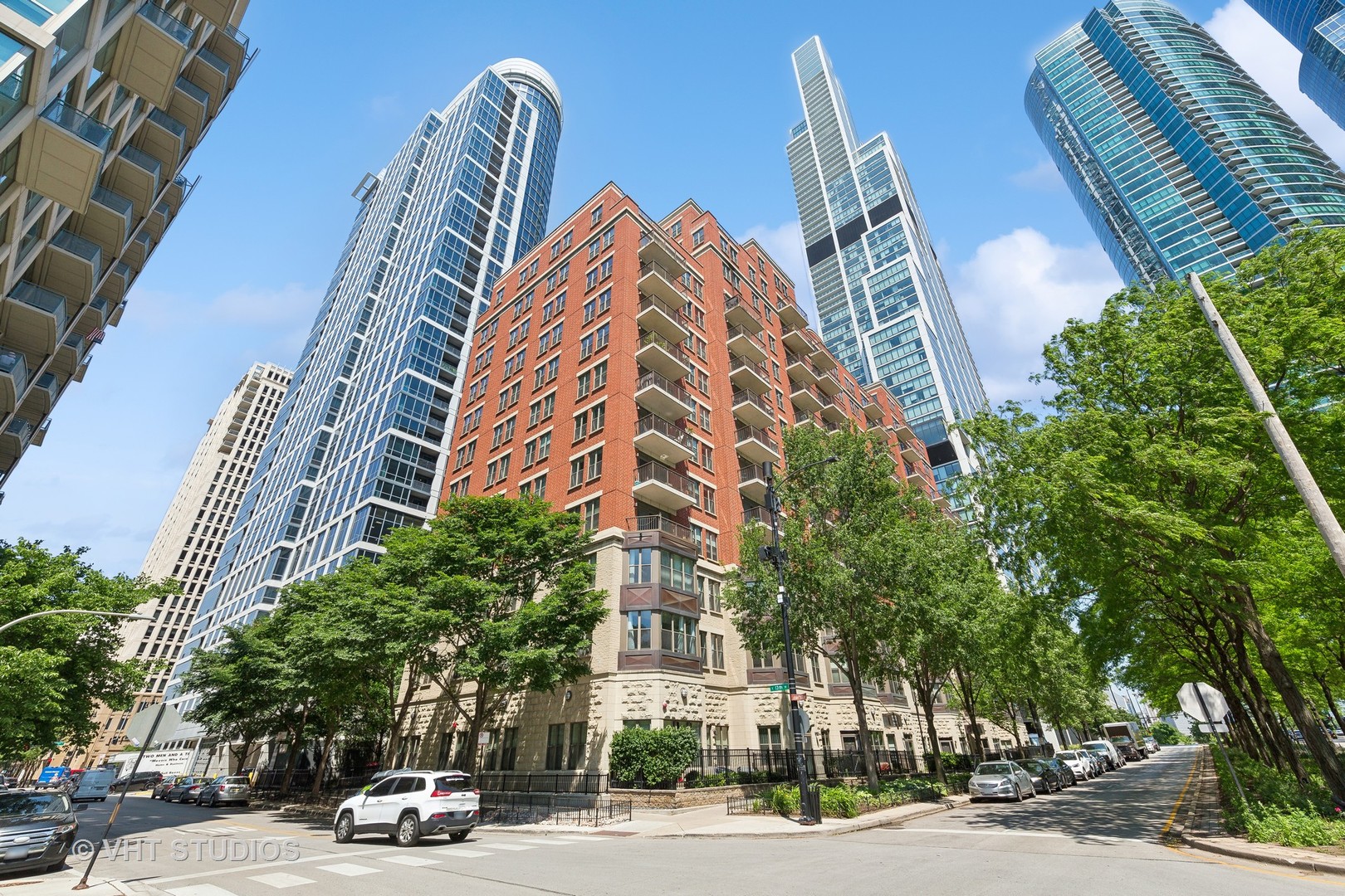 a view of a tall building next to a road