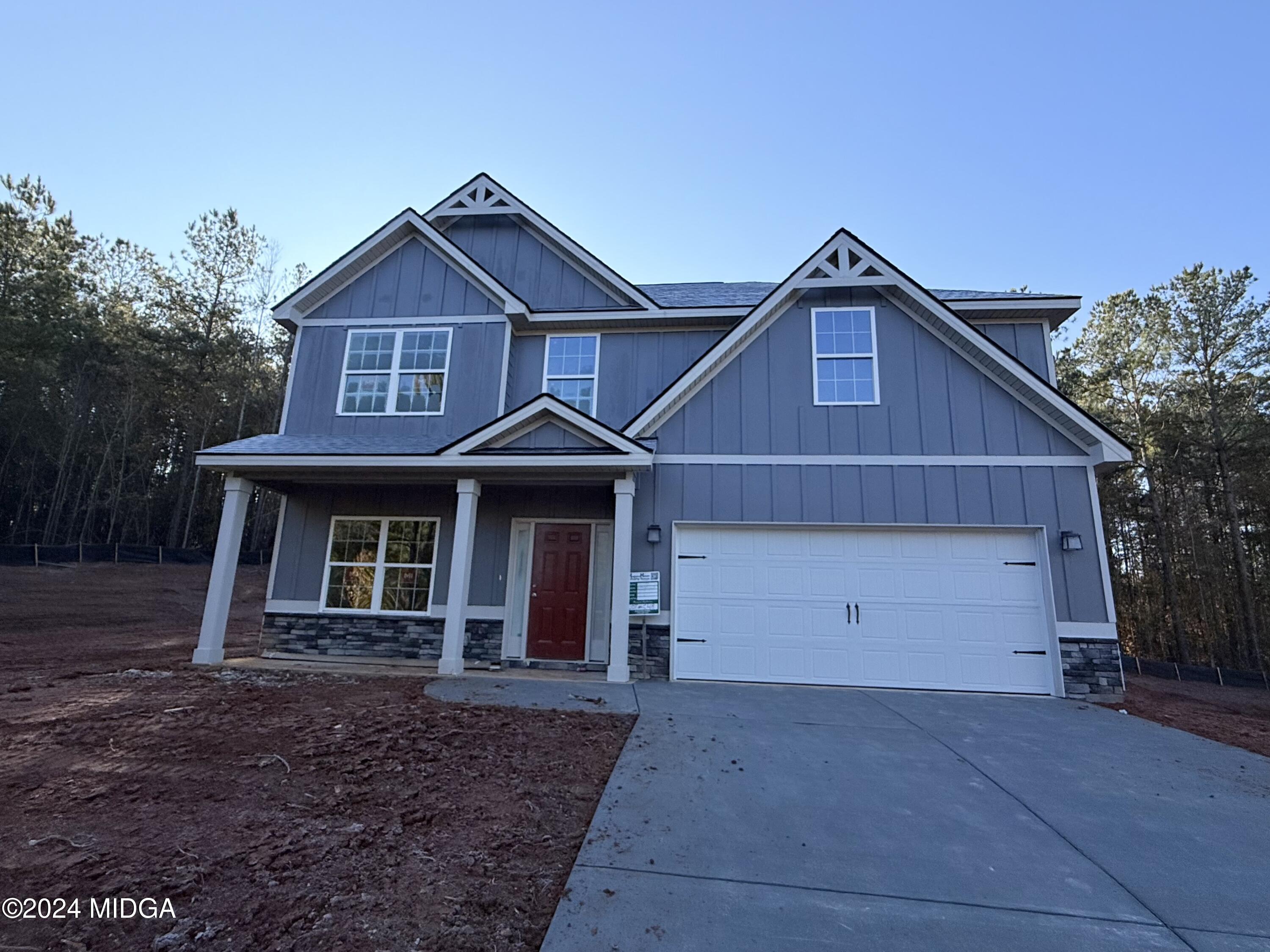 a front view of a house with yard