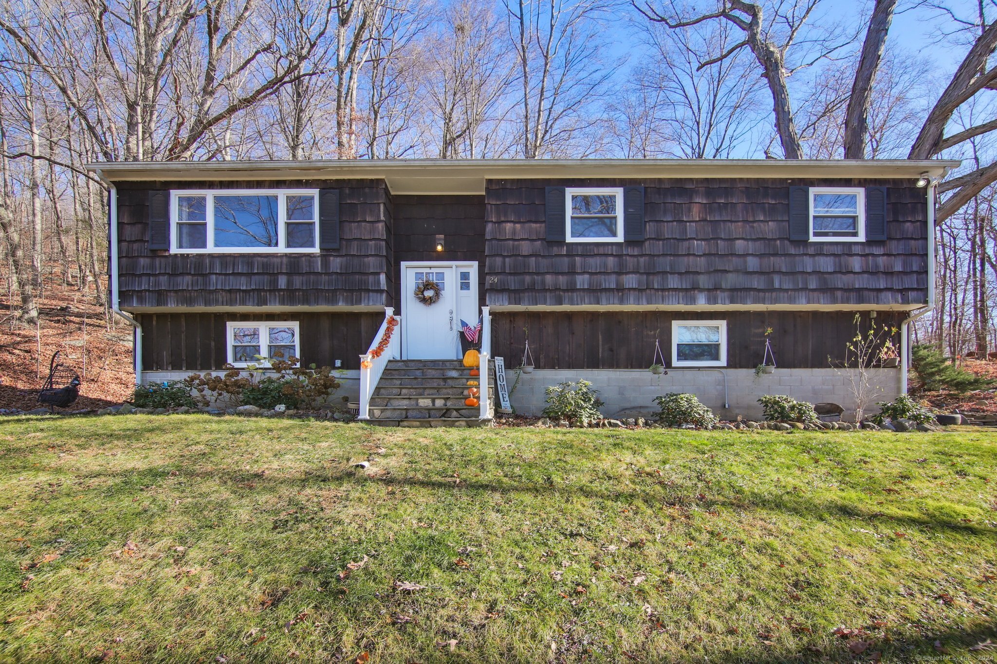 a front view of a house with a yard