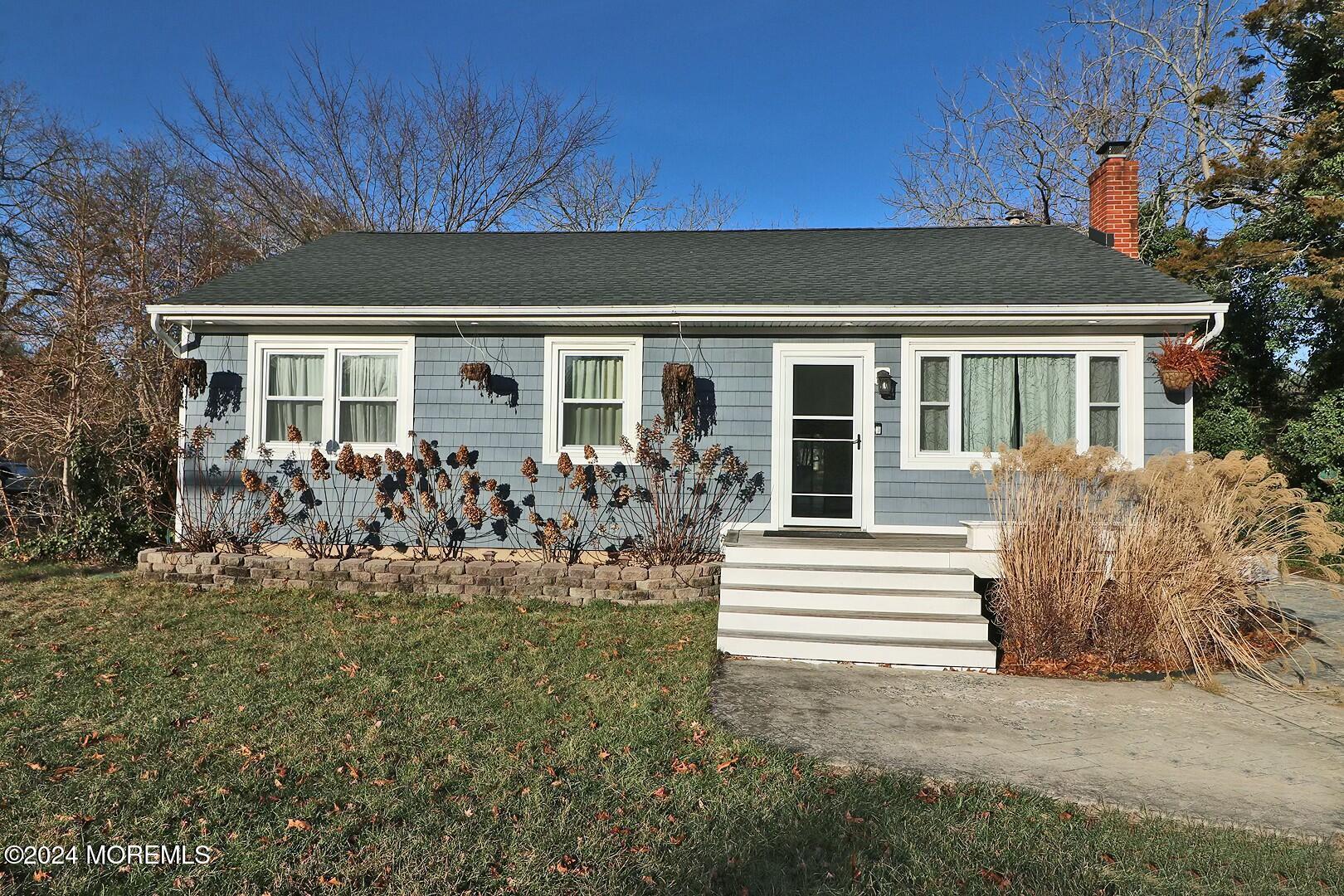 front view of a house with a yard