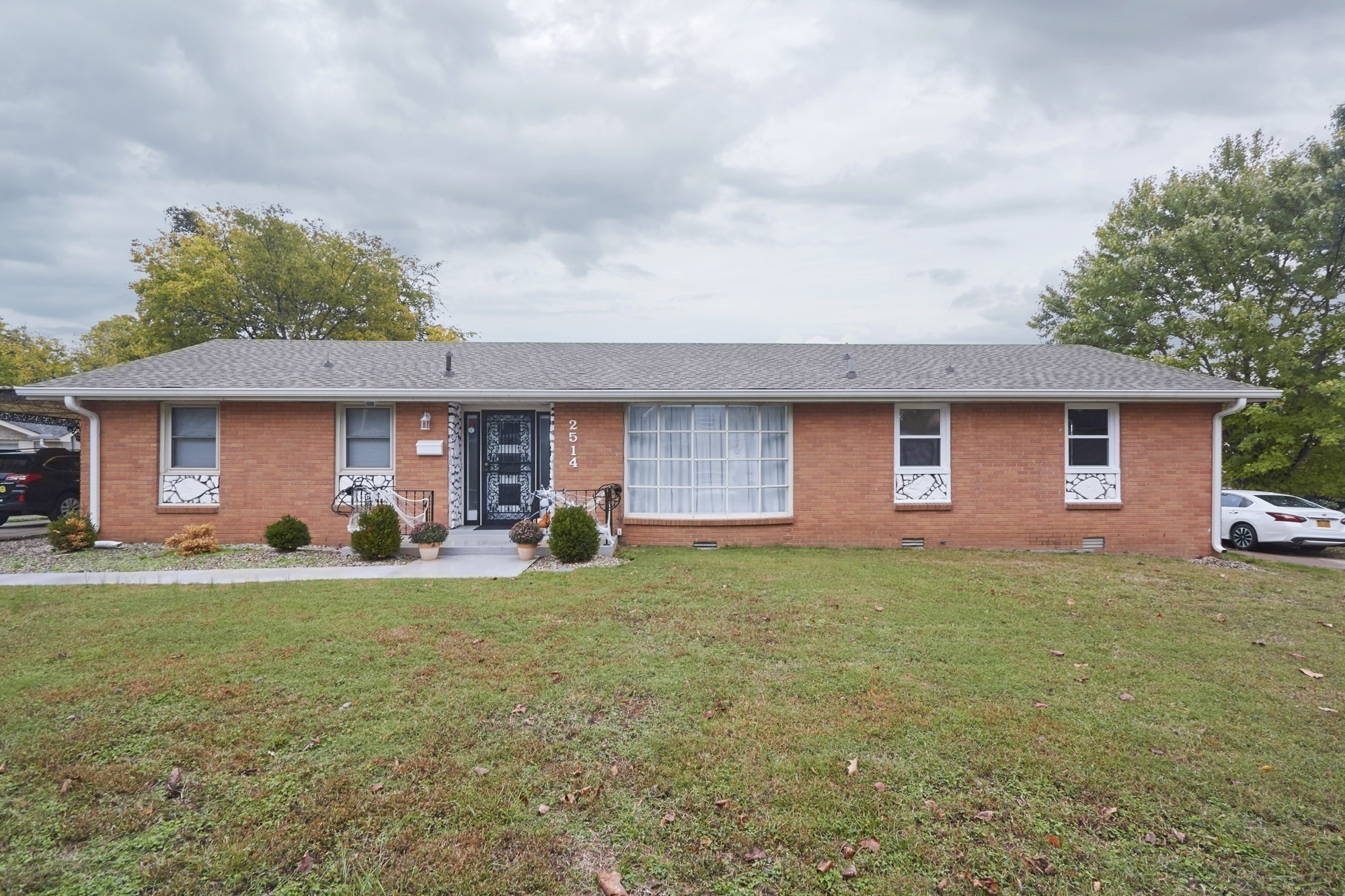 front view of a house with a yard