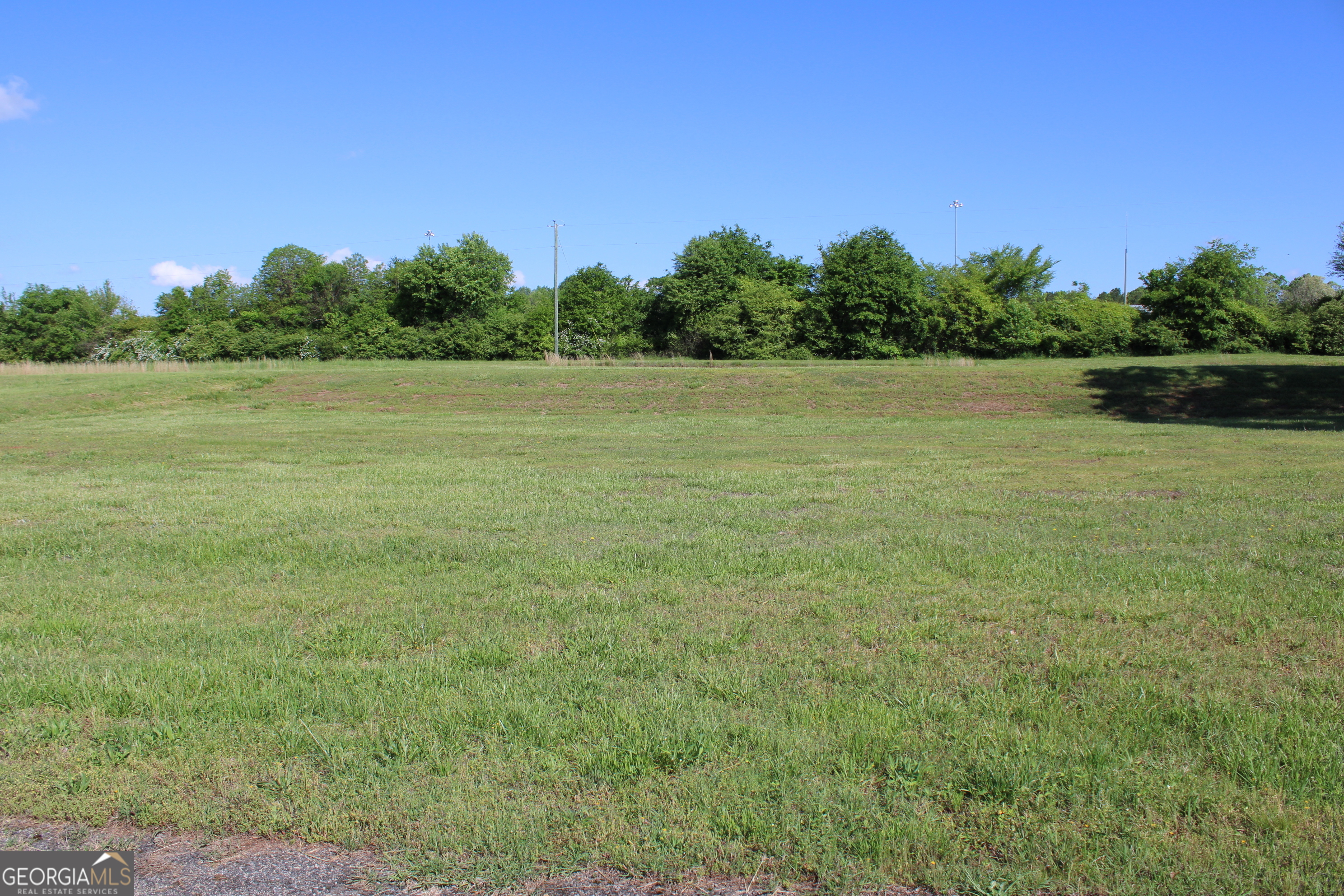 a view of a field with an outdoor space