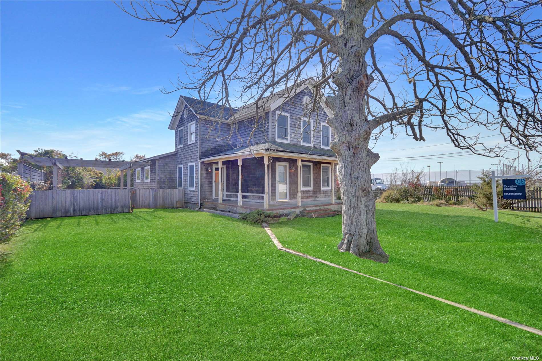 a view of a house with a backyard