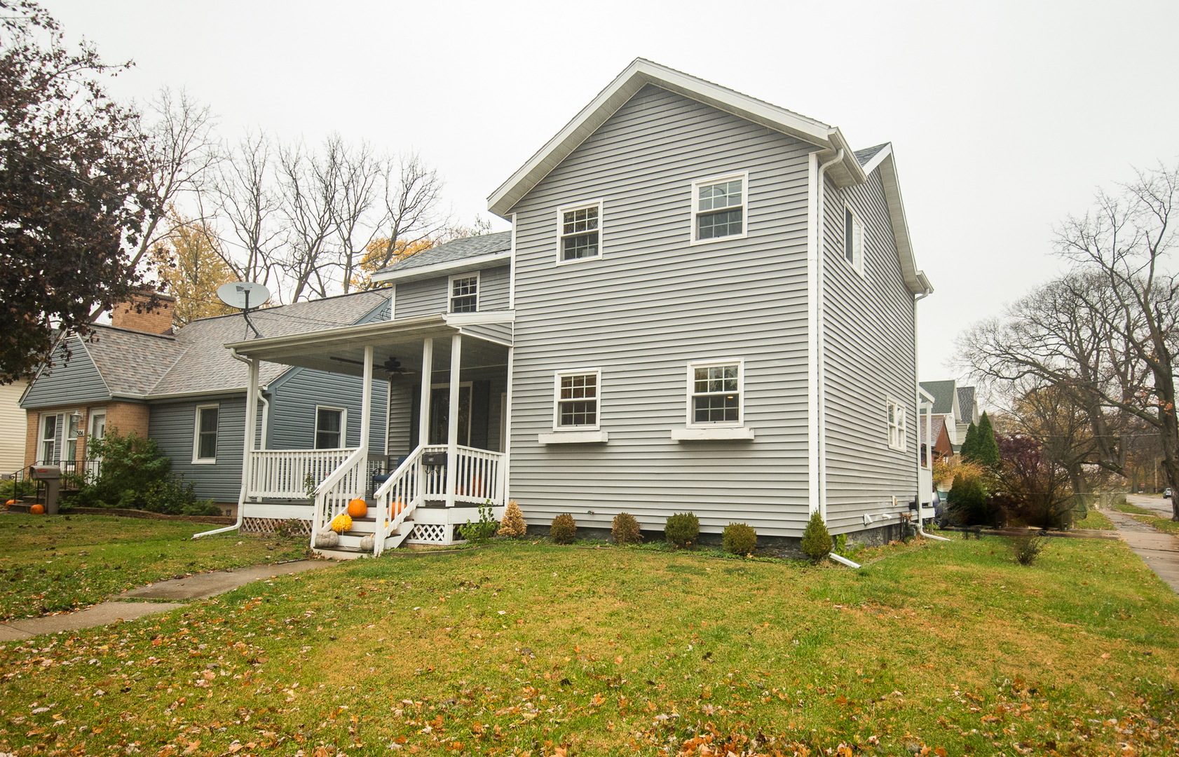 a front view of house with yard patio and green space