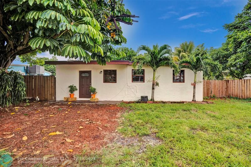 a house with trees in the background