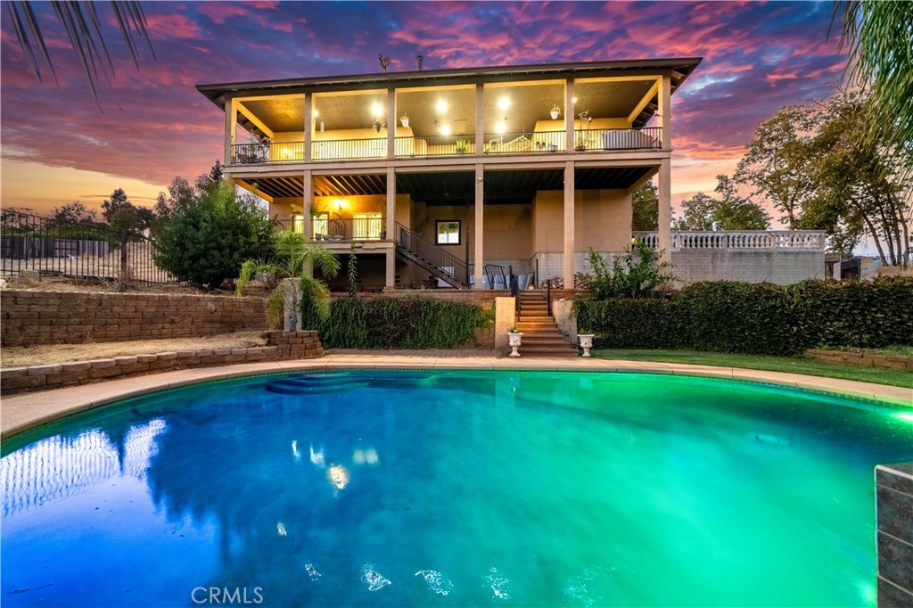 a front view of a house with swimming pool