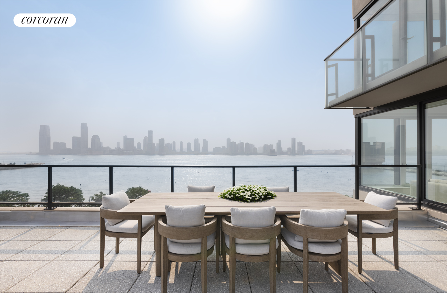 a view of balcony with furniture and city view