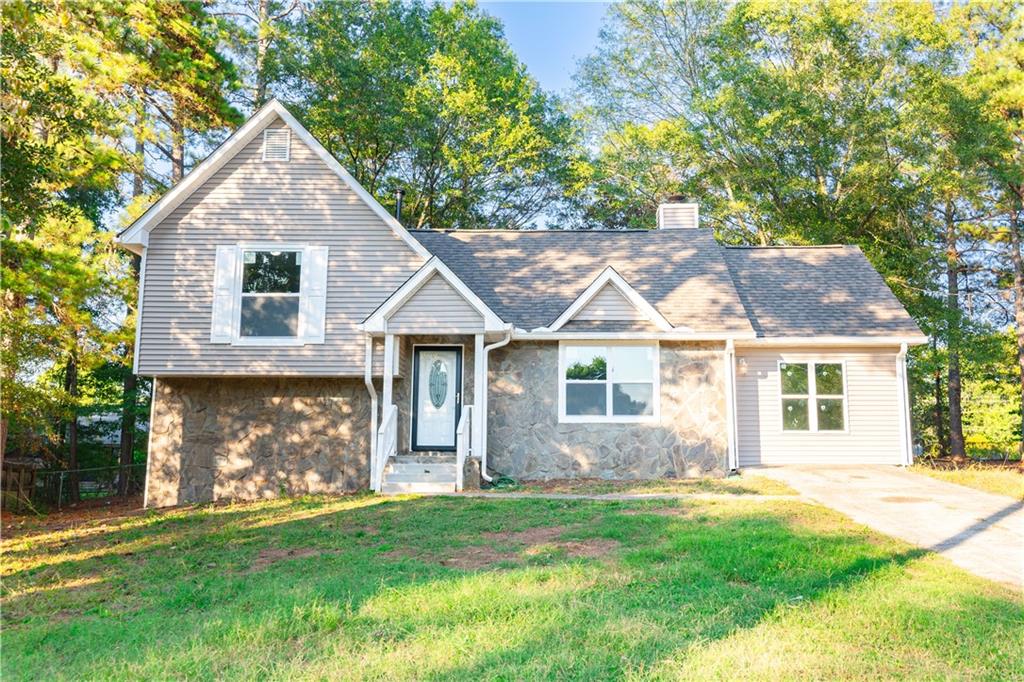 front view of a house with a yard