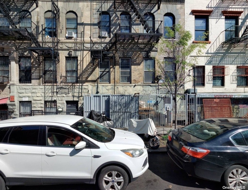 a front view of a building with parking space