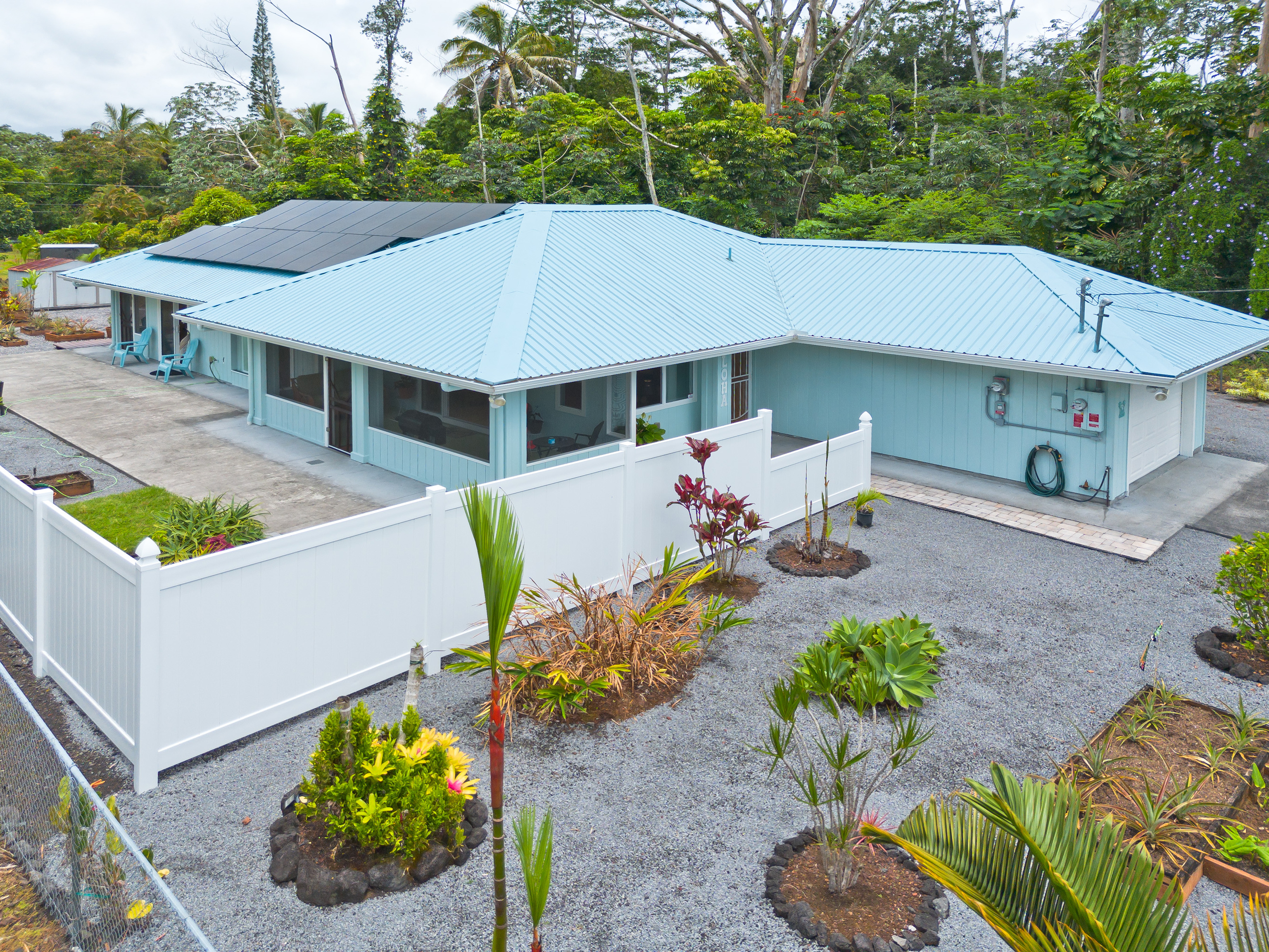 a house with lots of trees in the background