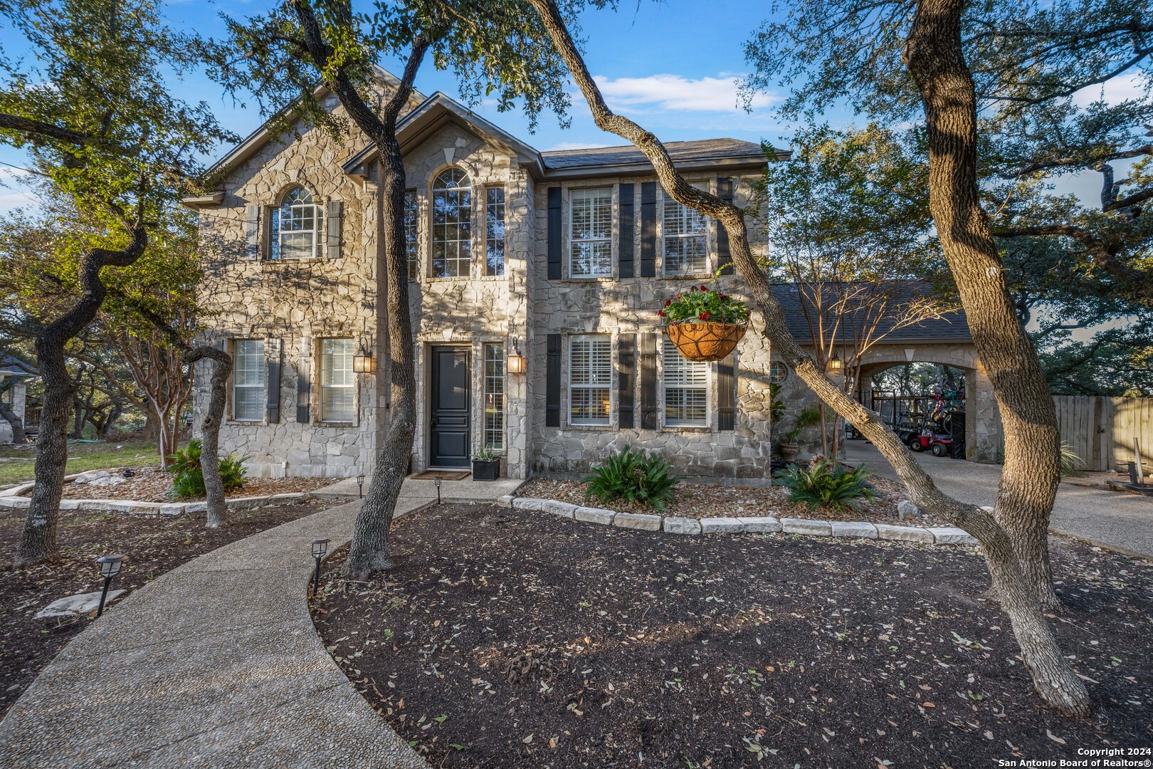 a front view of a house with garden