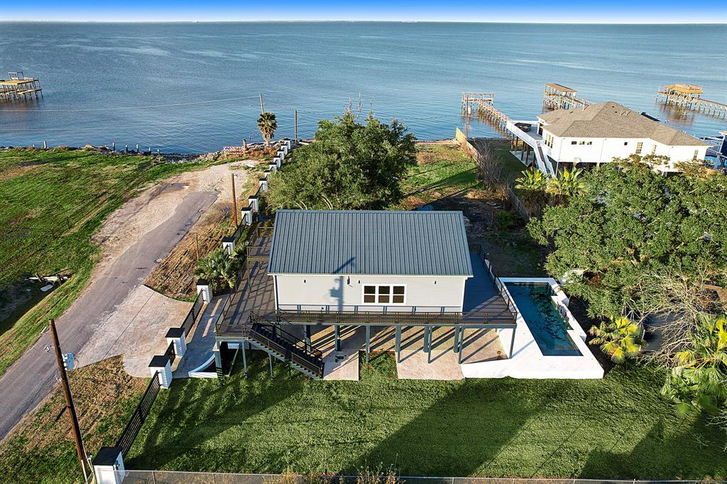 AERIAL VIEW HIGHLIGHTS THE LARGE SIDEYARD WHICH IS PERFECT FOR BOAT AND RV PARKING!