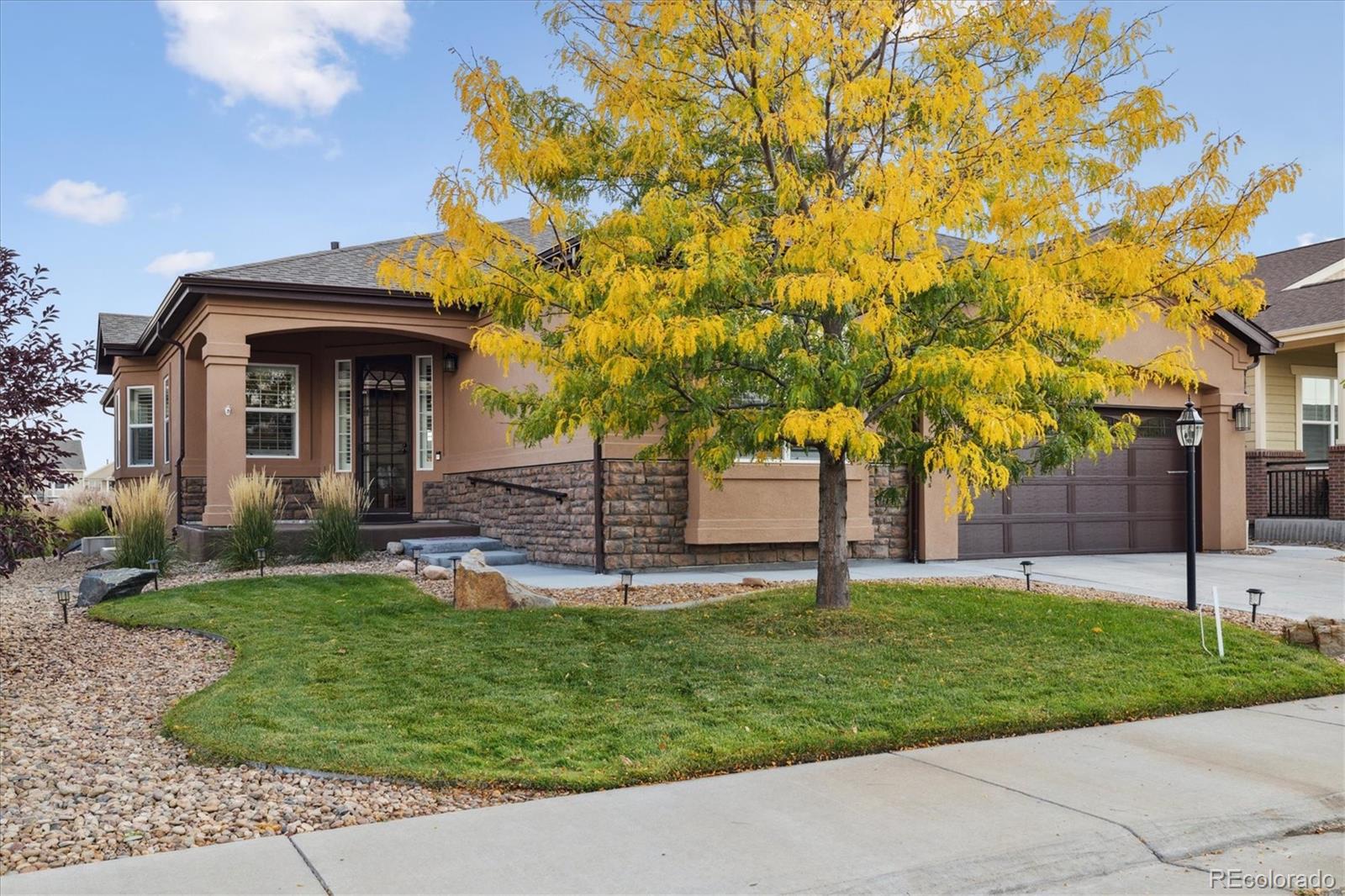 a front view of a house with a yard