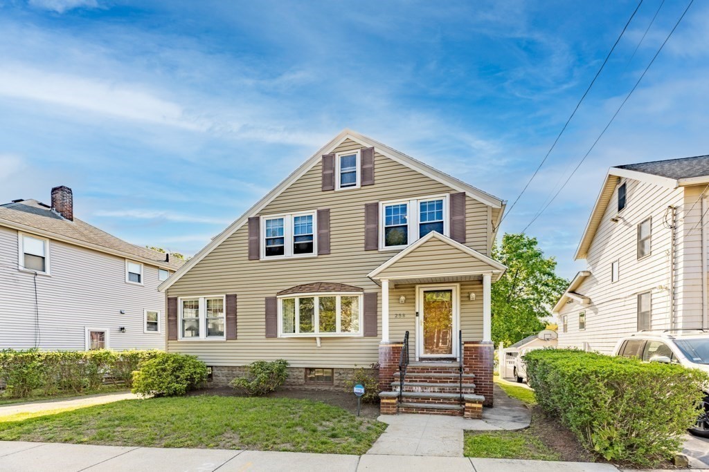 a front view of a house with a yard