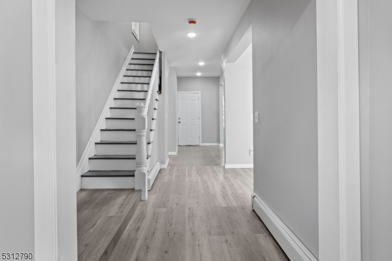 a view of entryway with wooden floor