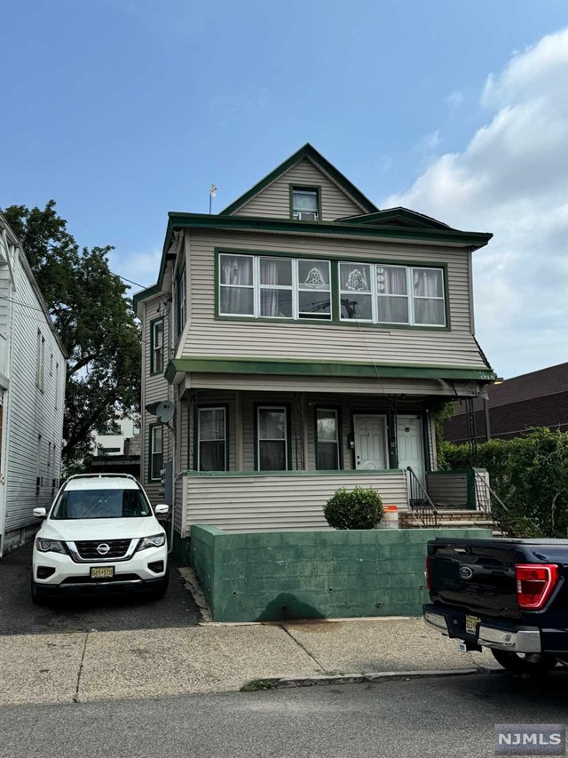 a car parked in front of a house