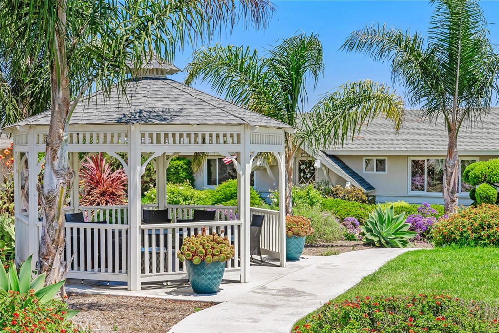 Common area courtyard features a pretty gazebo and tropical native landscape.