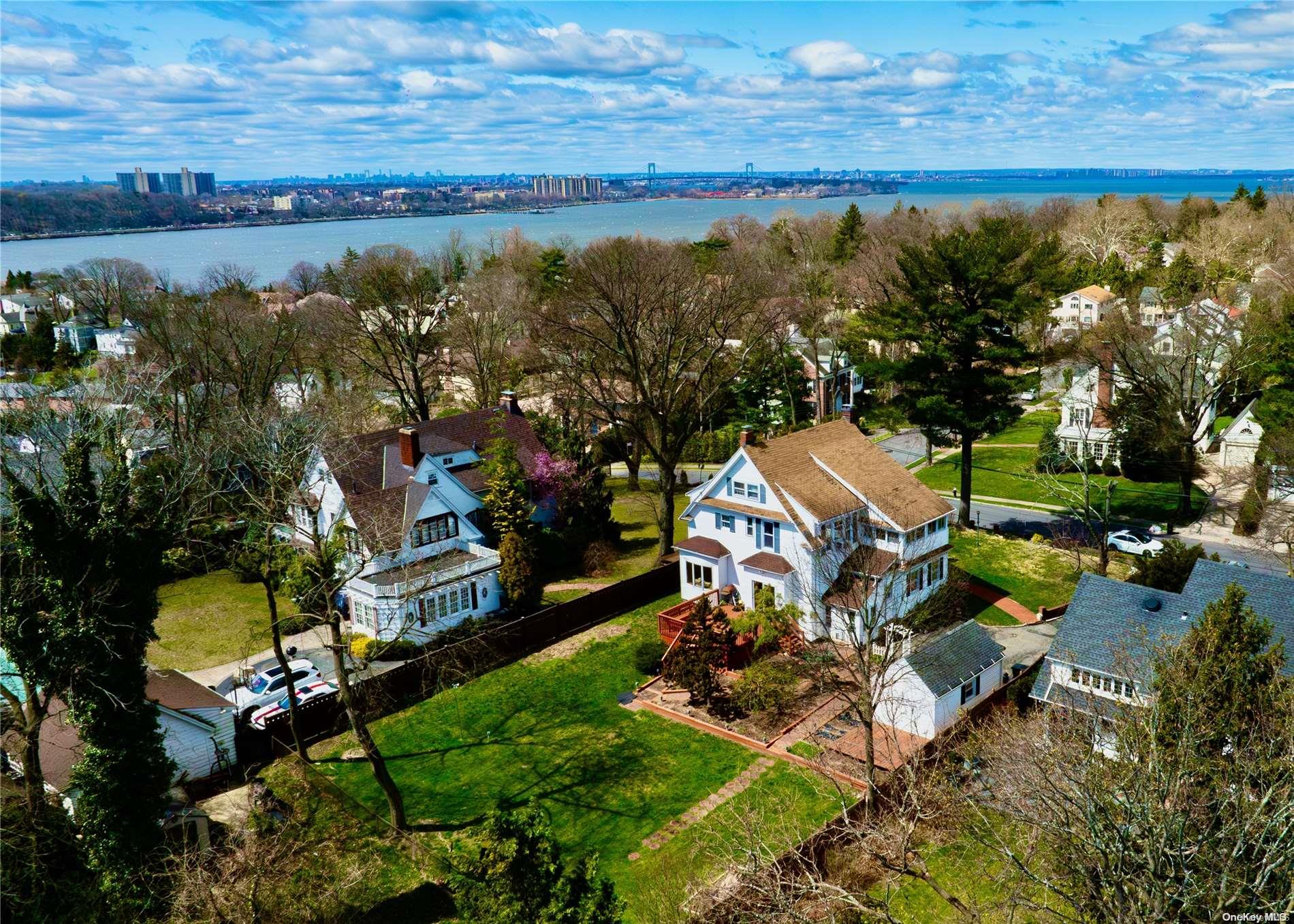 an aerial view of a house with a yard basket ball court and outdoor seating