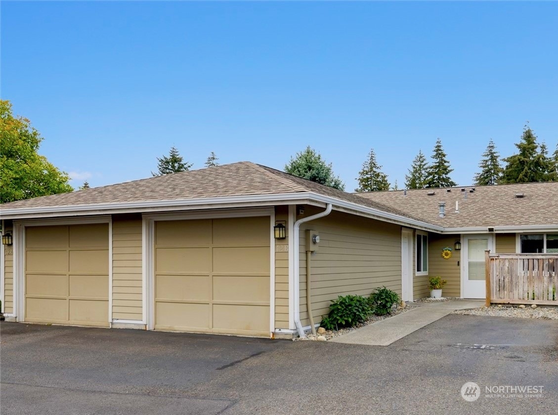 a front view of a house with garage