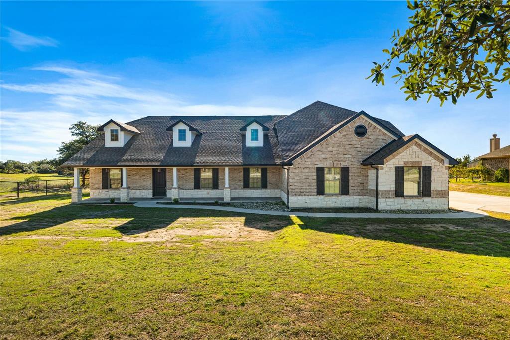 a front view of a house with swimming pool