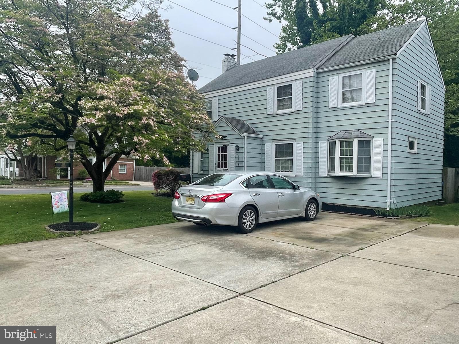 a view of a car parked in front of a house