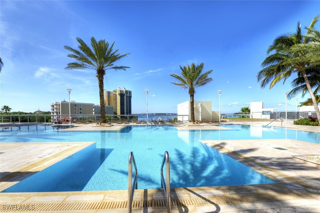 a view of swimming pool with outdoor seating