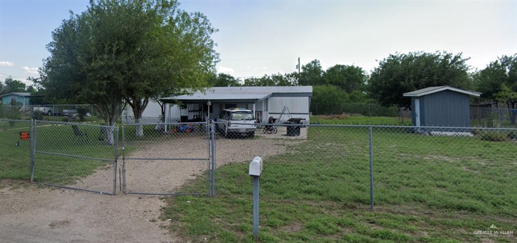 a view of a house with backyard porch and garden