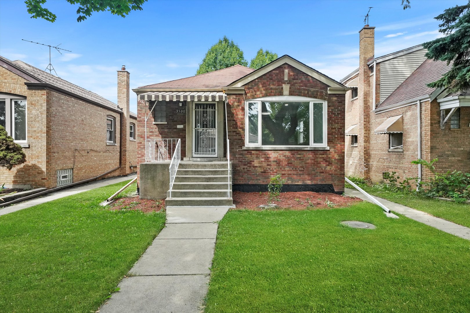 a front view of a house with a yard