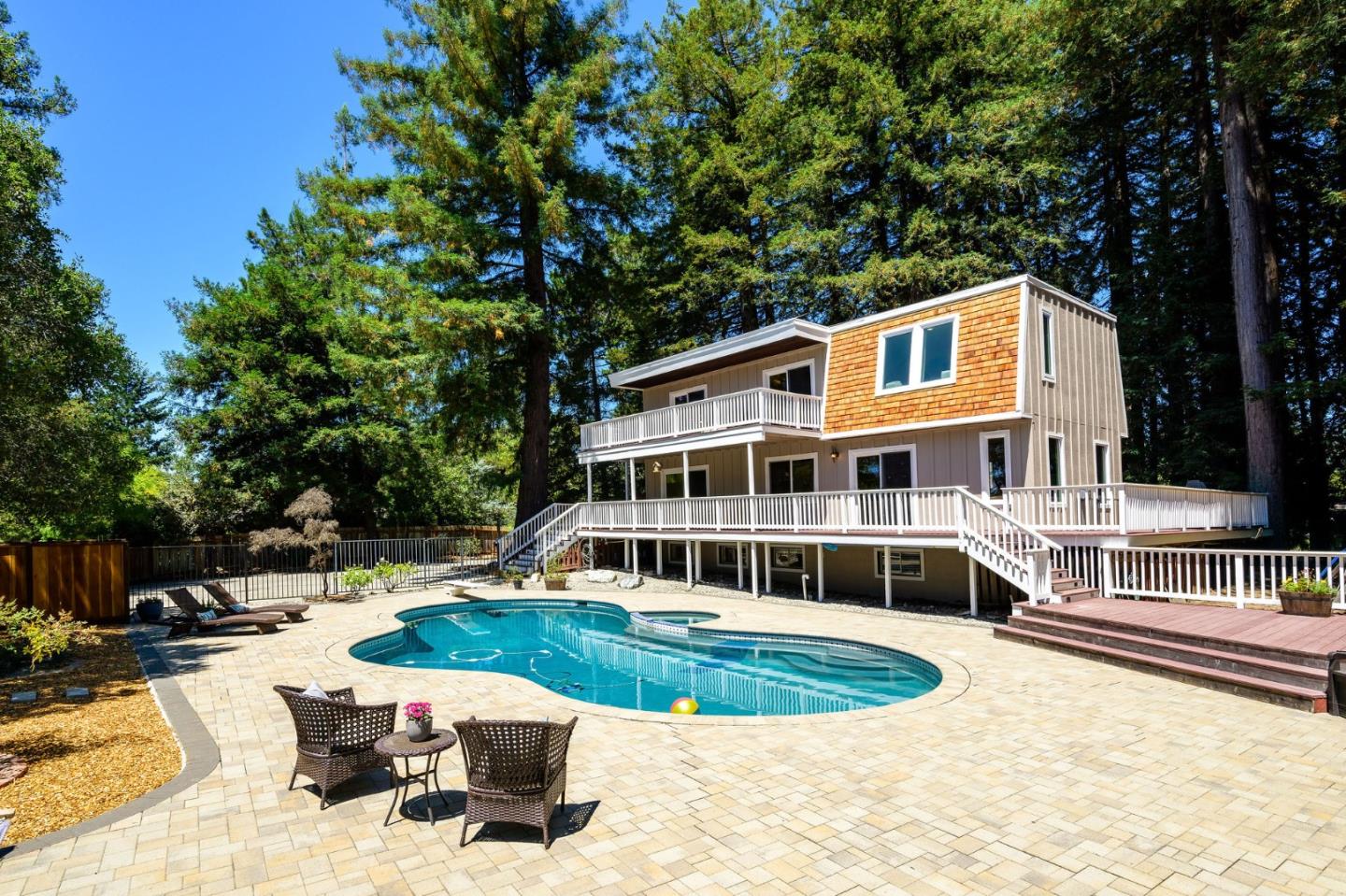 a front view of a house with a swimming pool