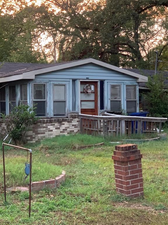 a backyard of a house with barbeque oven