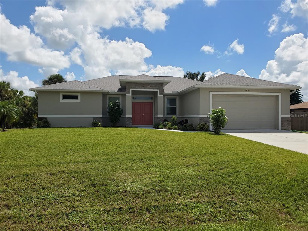 a front view of house with yard and green space