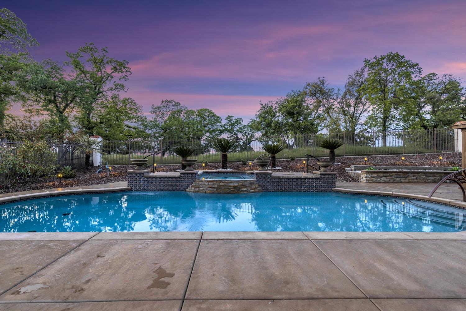 a view of a swimming pool with a yard