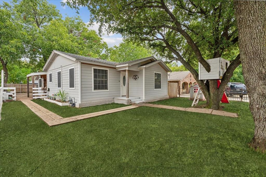 a view of a house with a yard porch and sitting area