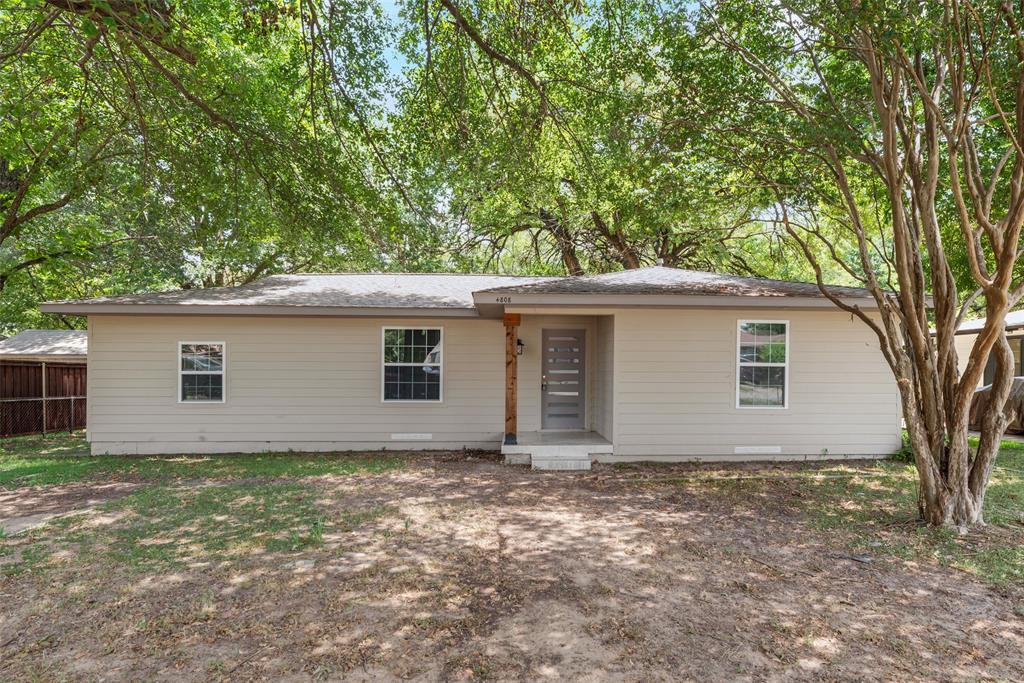 a house with trees in the background