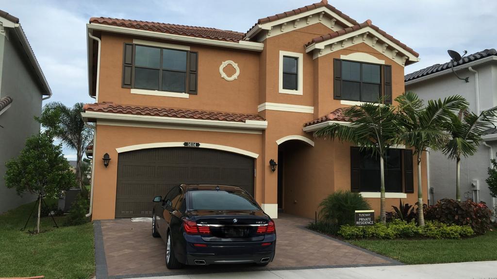 a car parked in front of a house