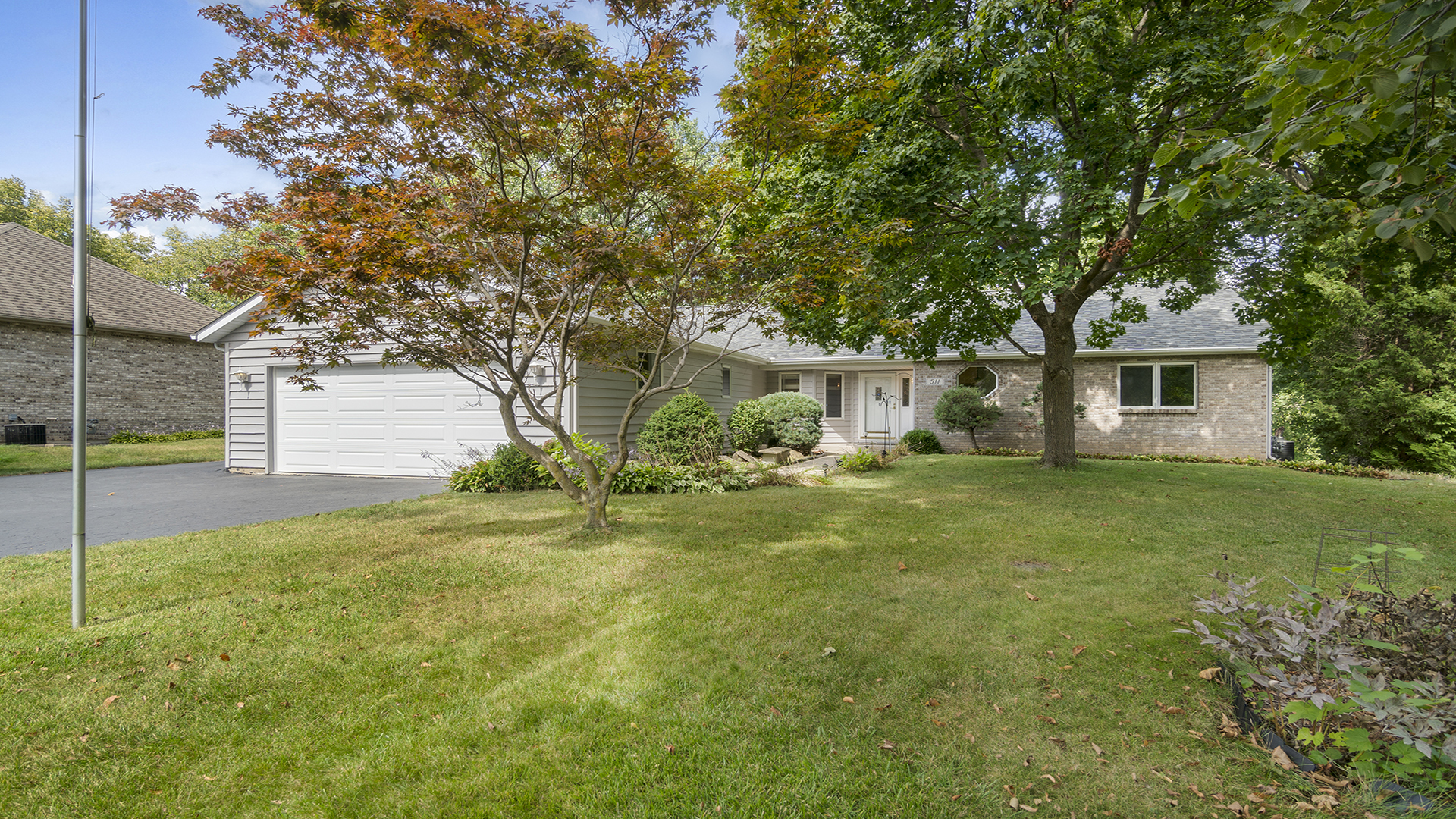 a view of a house with a back yard