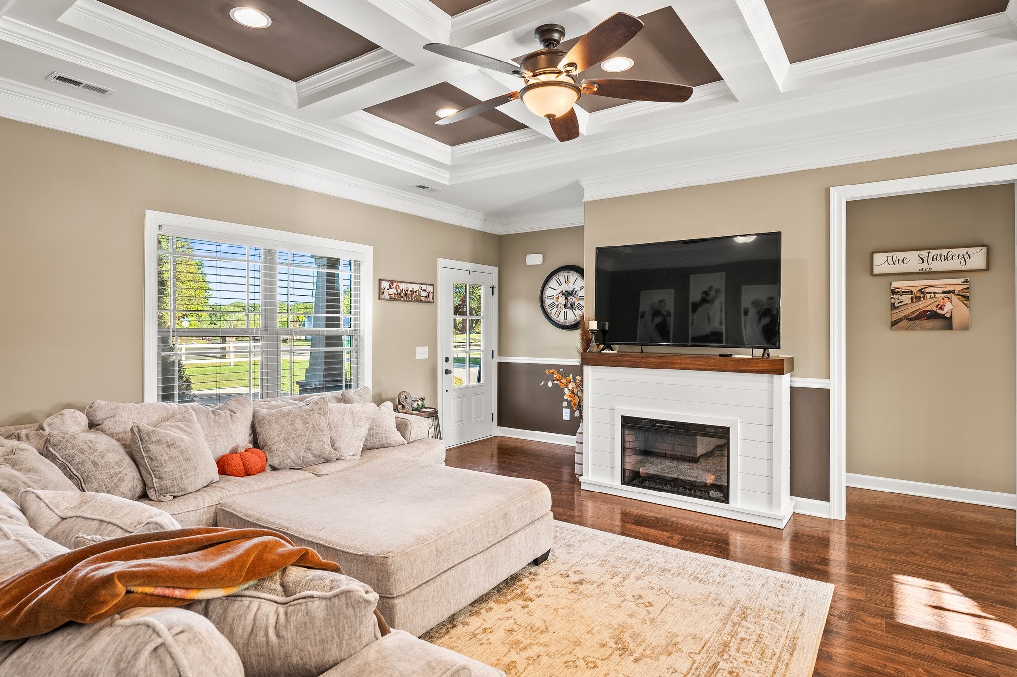 a spacious bedroom with a bed and a fireplace