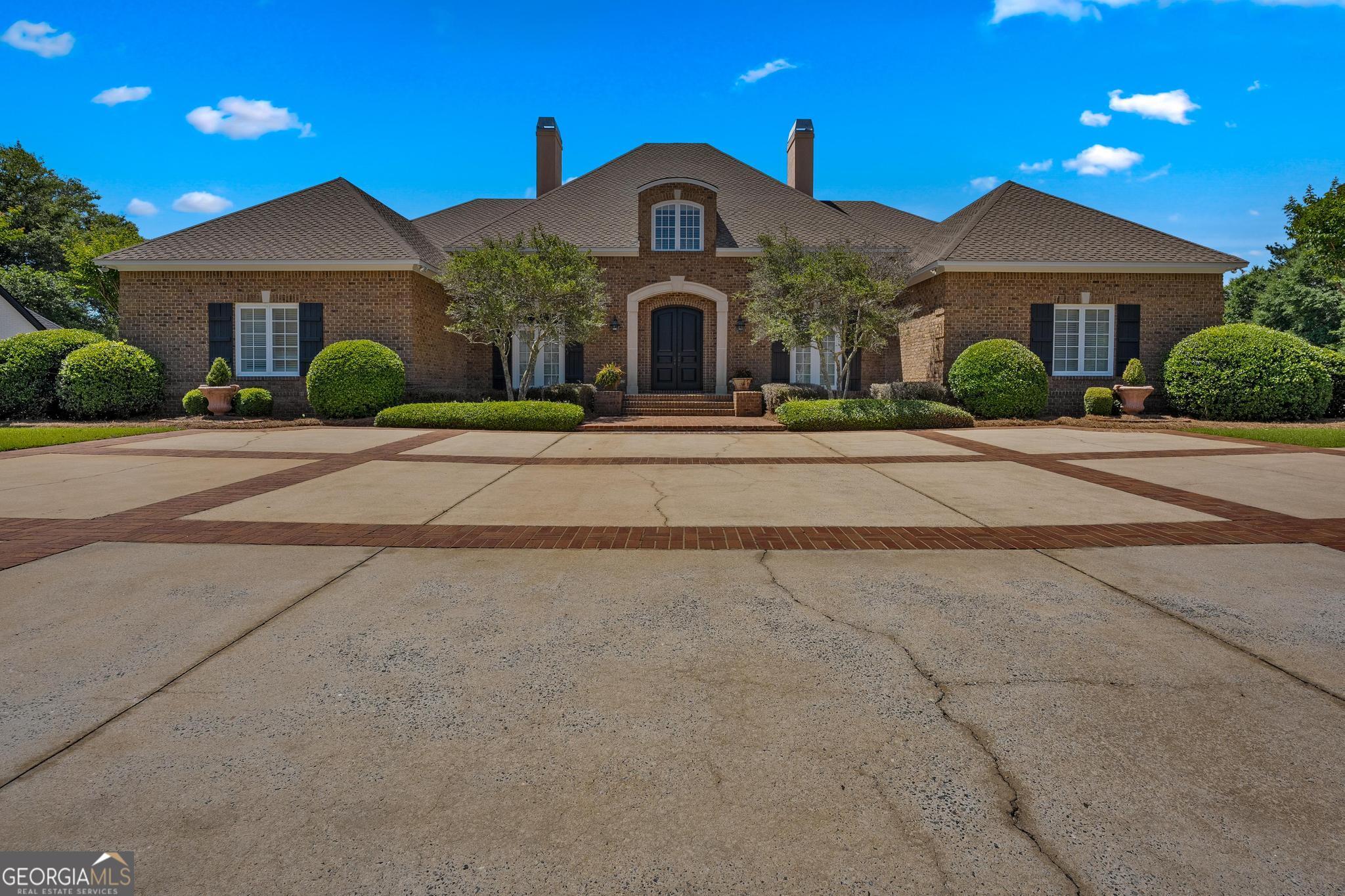 front view of a house with a yard