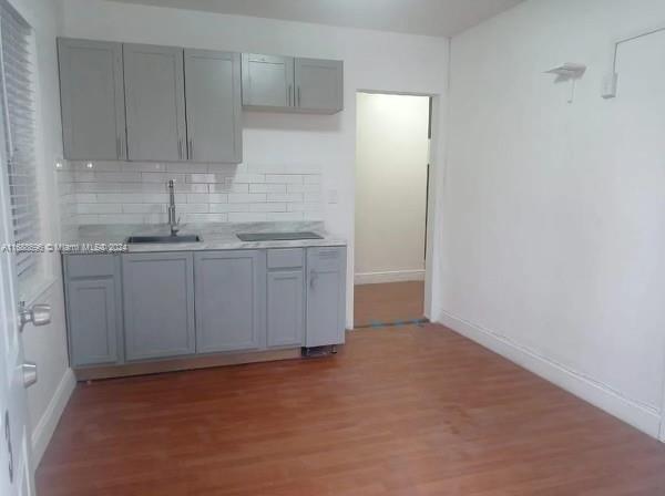 a kitchen with white cabinets