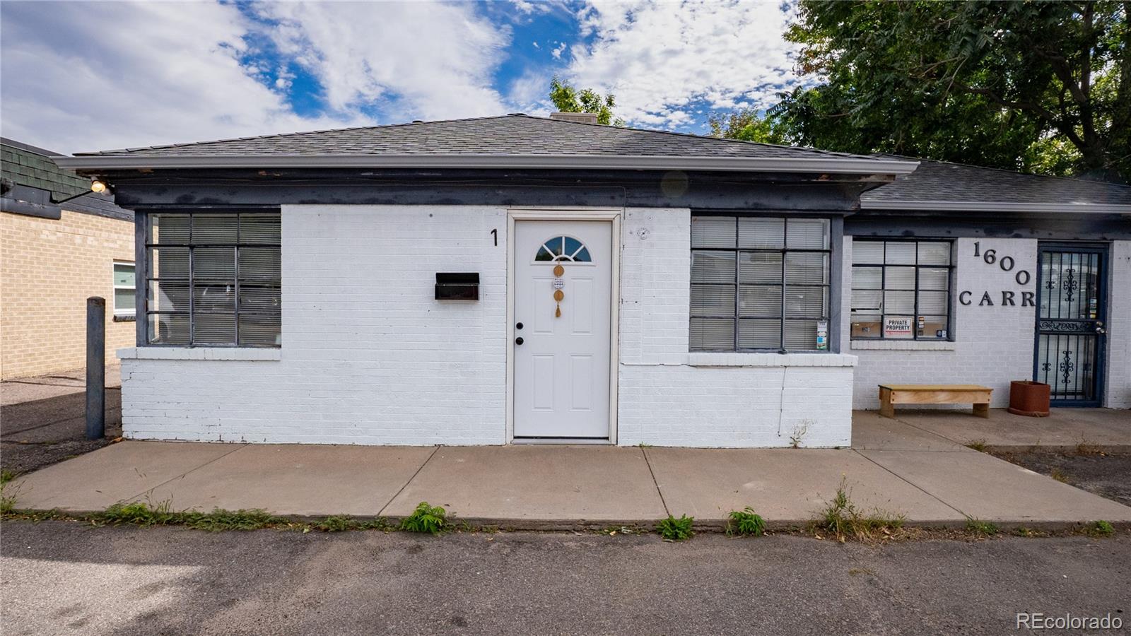 a front view of a house with garage