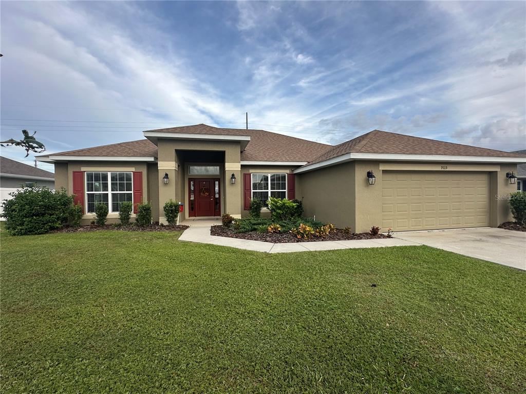 front view of a house with a garden