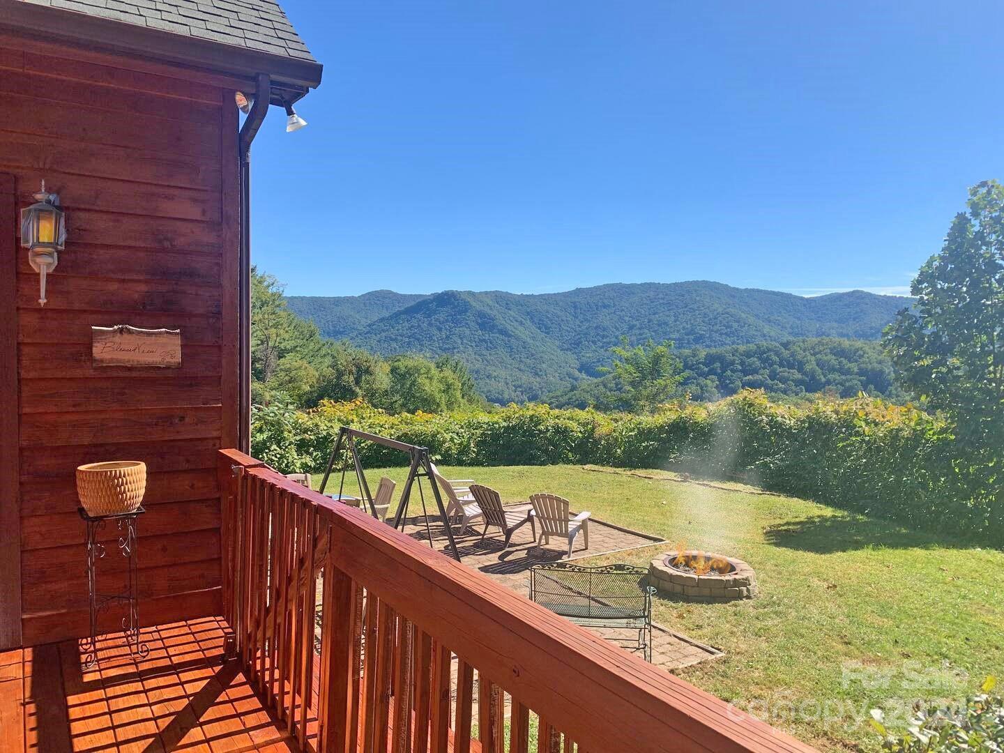 a view of a two chairs in the balcony