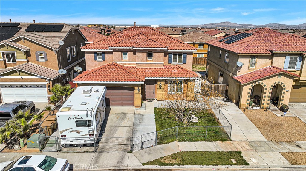 an aerial view of a residential apartment building with a yard